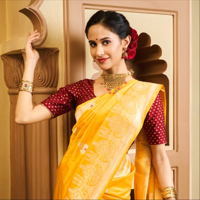 Image of a model wearing a beautiful Yellow Saree by Aisraa